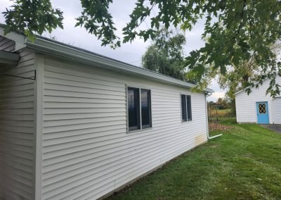 Custom seamless aluminum gutters on a Vermont home — The Gutter Guys